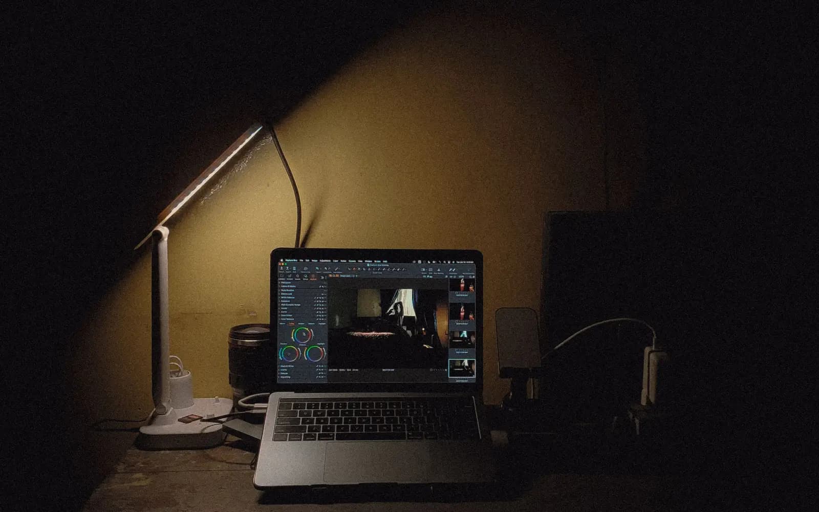 A lamp-lit workspace running the Tuned operating system